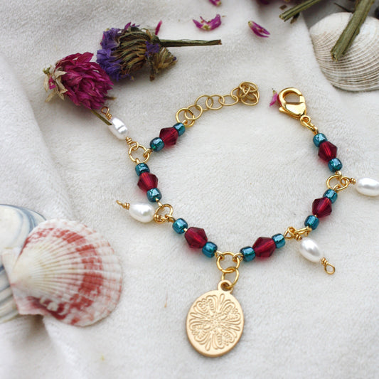 gold charm bracelet with pearl dangles