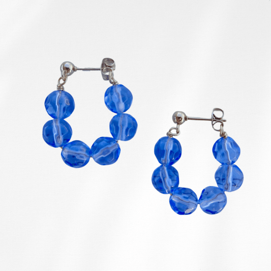 handmade blue beaded hoop earrings.