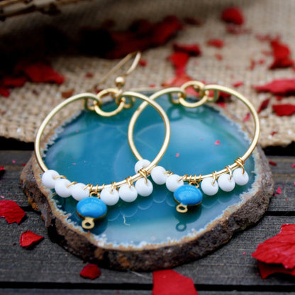 Blue SkiesMaterial info: Gold hoop earrings with wire wrapped beads Beads: wrapped white seed beads and green turquoise brass coin link 12x6 mm. Tarnish resistant, 16-gauge gold copper wire Jump ring: 18k gold plated All jewelry is handmade and made to or