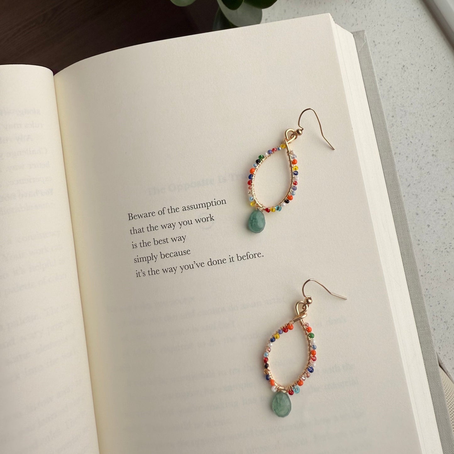 Small colorful beaded earrings .