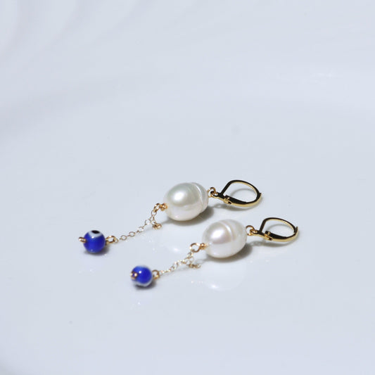 Evil eye dangle earrings with leverback findings and white pearl.