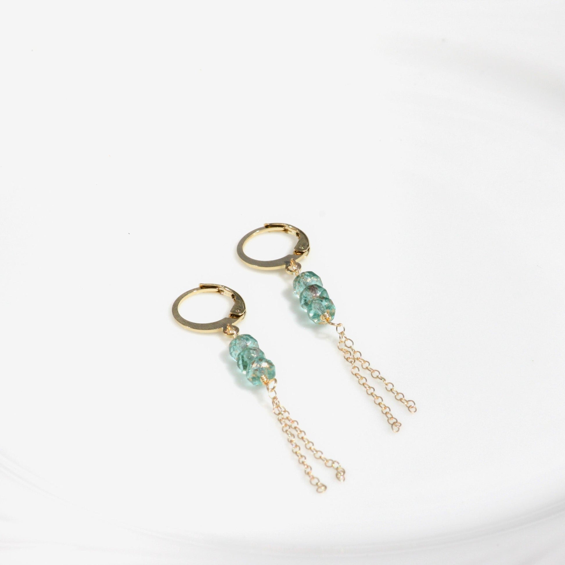 Pastel Cascade Huggie Earrings in Light Blue.