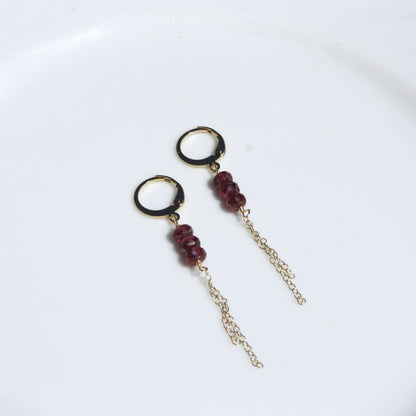 Gold huggie dangle earrings in ruby.