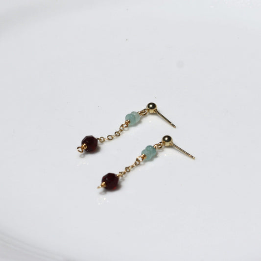 Dainty ball post dangle earrings with garnet beads.