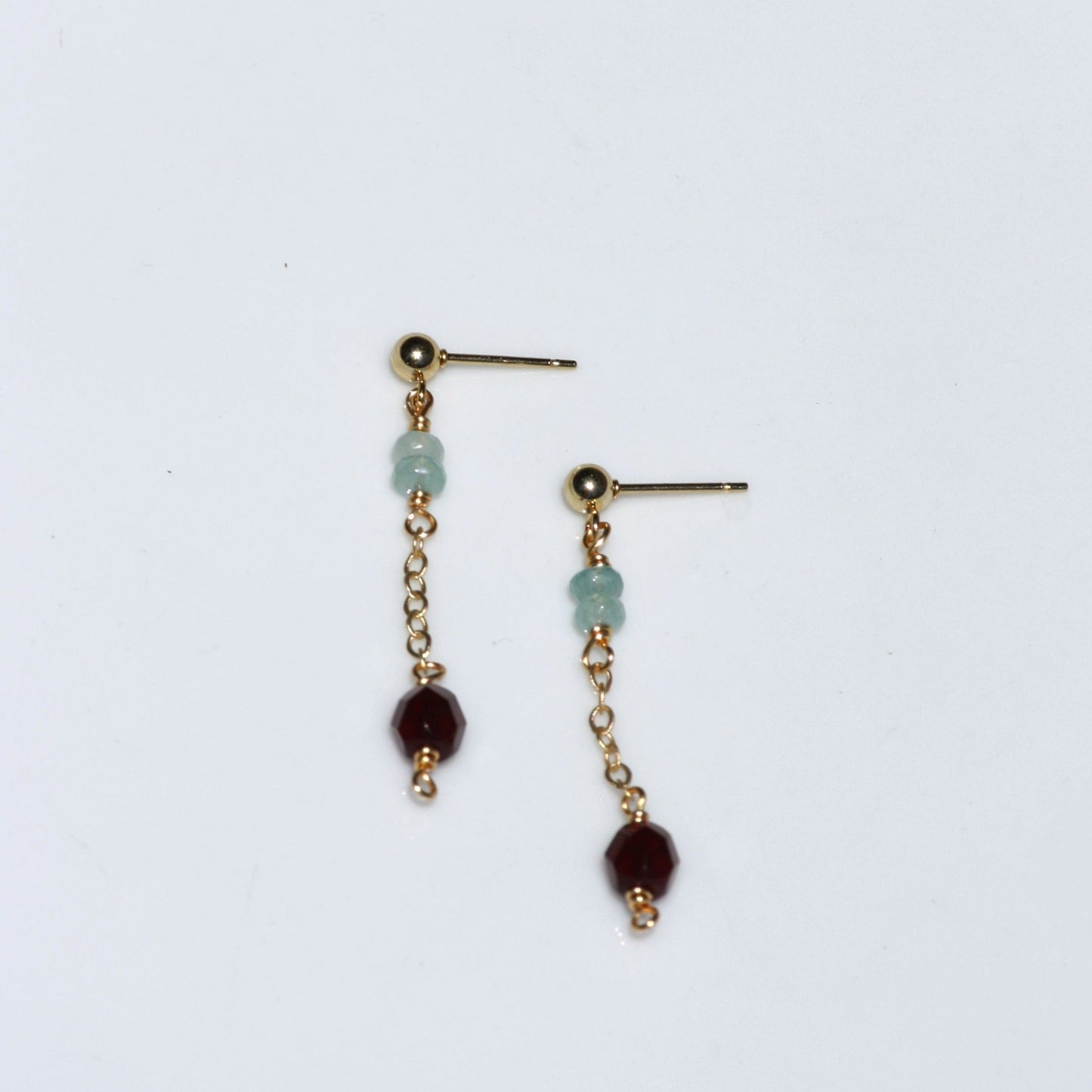 Dainty dangle earrings with gold chain.