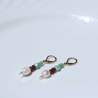 Leverback dangle earrings with pearls.